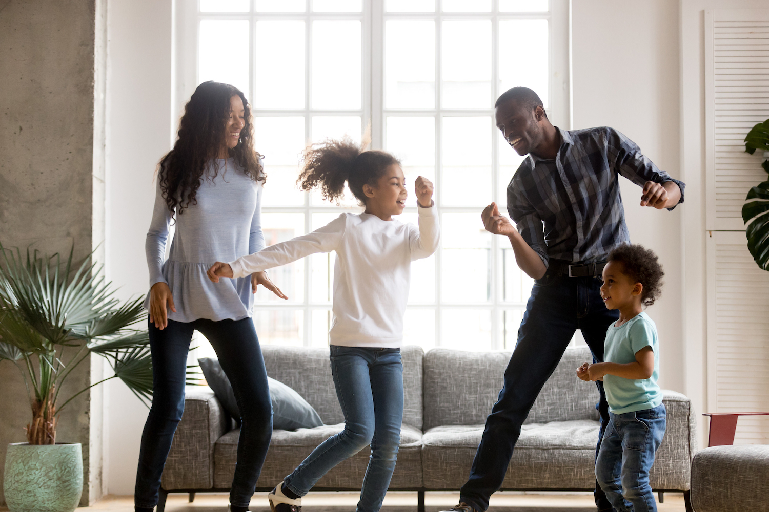 family dancing in living room